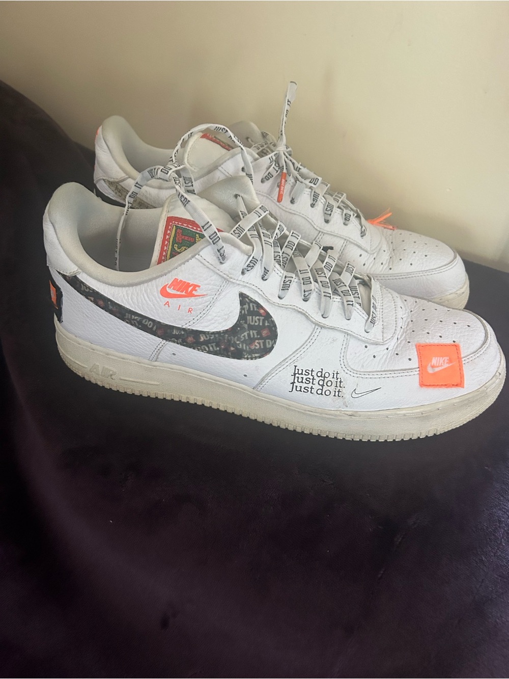 Nike White Sneakers with Black Swoosh and Orange Accents